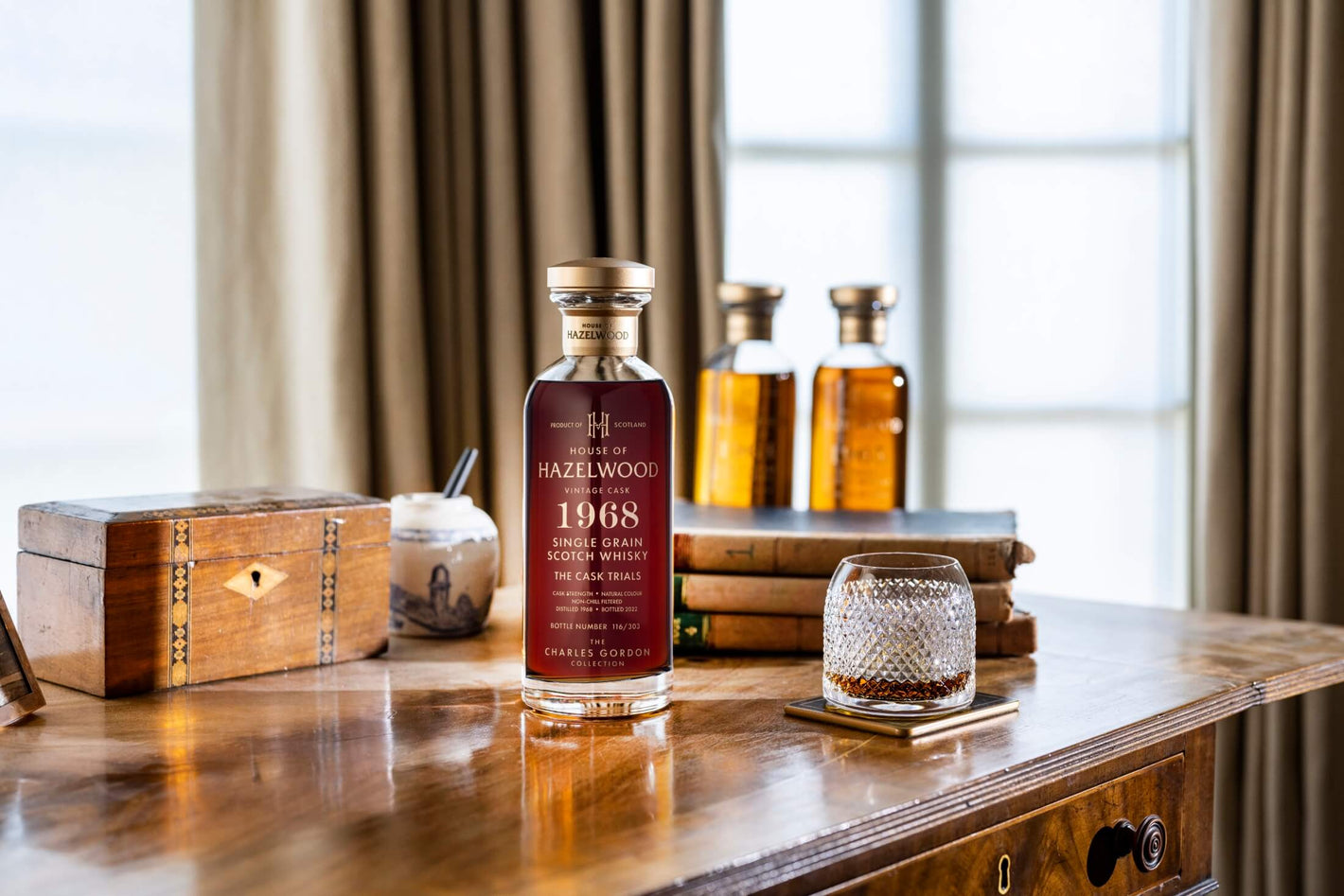 A bottle of The Cask Trials sitting on a desk.