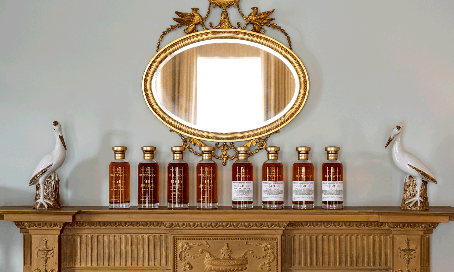 House of Hazelwood Whiskies lined in a row on top of a mantel